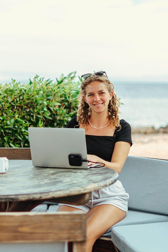 digital nomad, work online, cowork, laptop, macbook, beach, sea, work, workplace, location independent, sun, call, zoom, meeting, online meeting, webinar, video conference, nature, online, teams, hands, pretty, woman