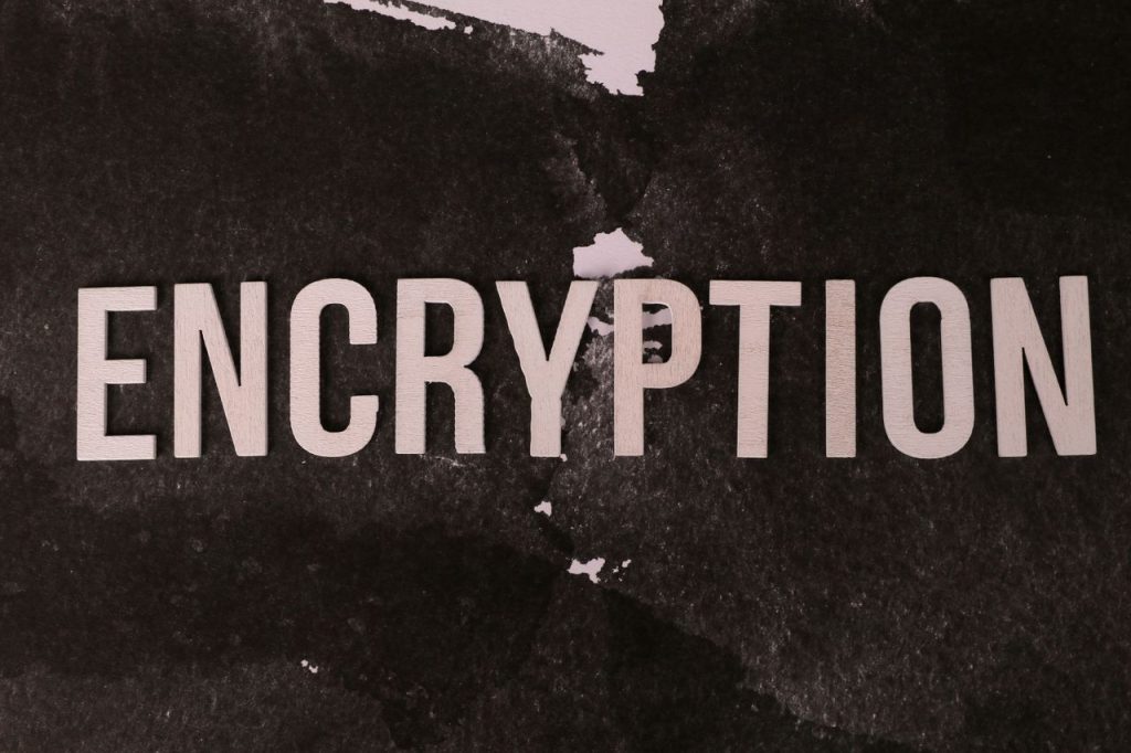 pexels photo 38486959 38486959 Black and white abstract image with the word 'ENCRYPTION' prominently displayed.